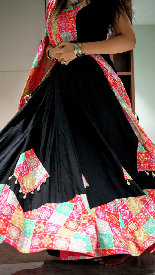 A black lehenga (skirt) with colorful, patterned patches and shell embellishments -set of 3