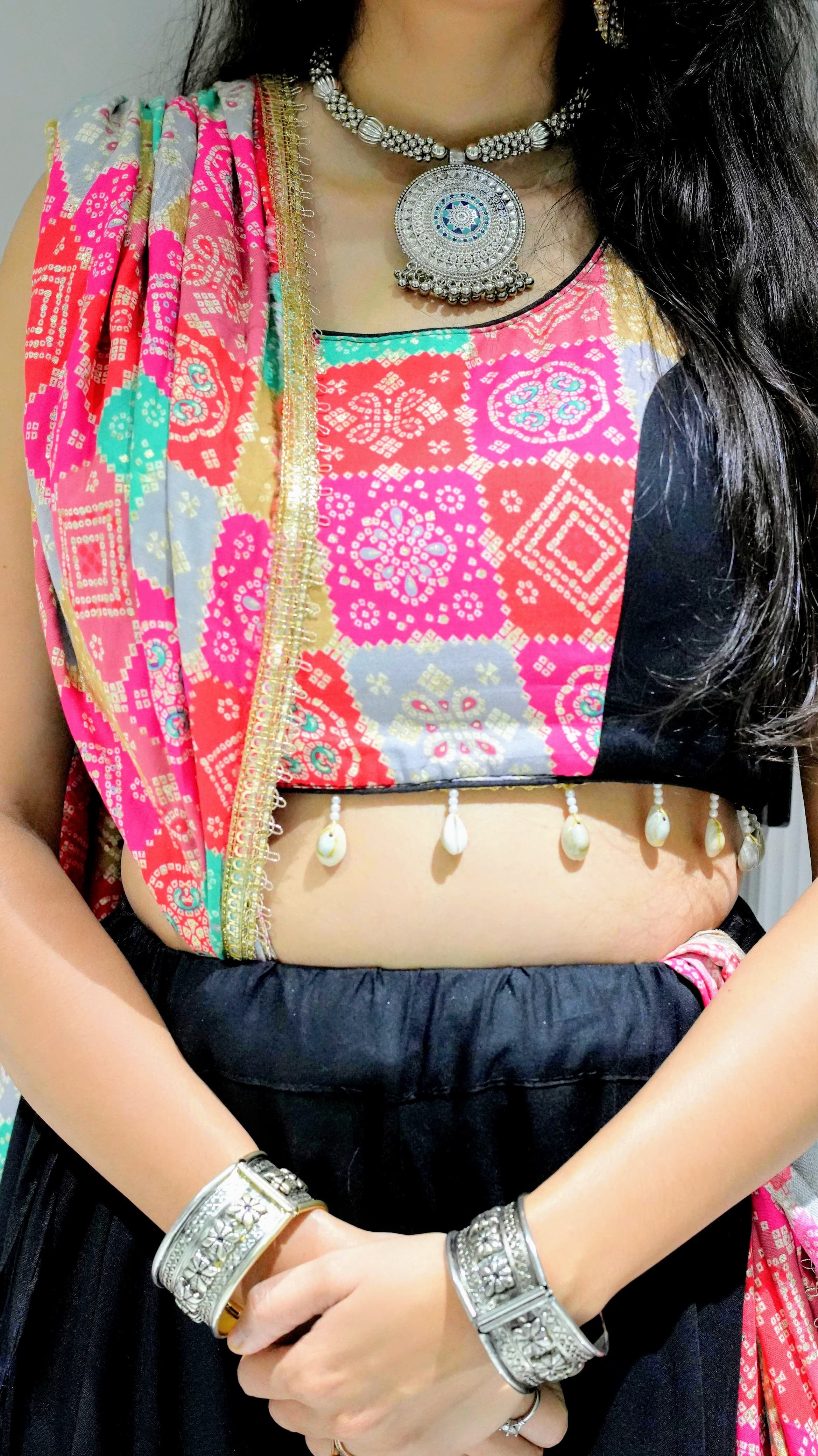 A black lehenga (skirt) with colorful, patterned patches and shell embellishments -set of 3
